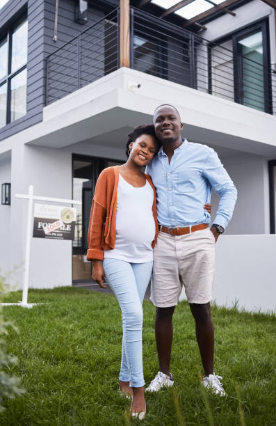 A couple outside their home