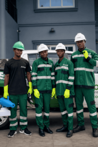 Nikao team beside the company vehicle